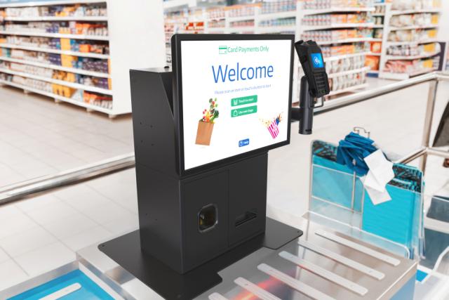 Counter-mounted self-checkout kiosk in a supermaket
